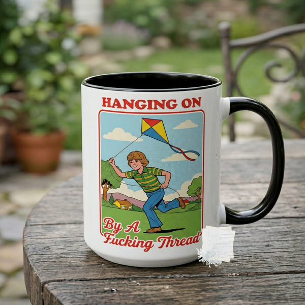 Hanging on by a fucking thread Funny Coffee Mug