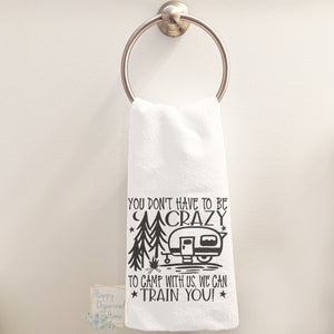 You don't have to be crazy to camp with us, we can train you - Hand Towel